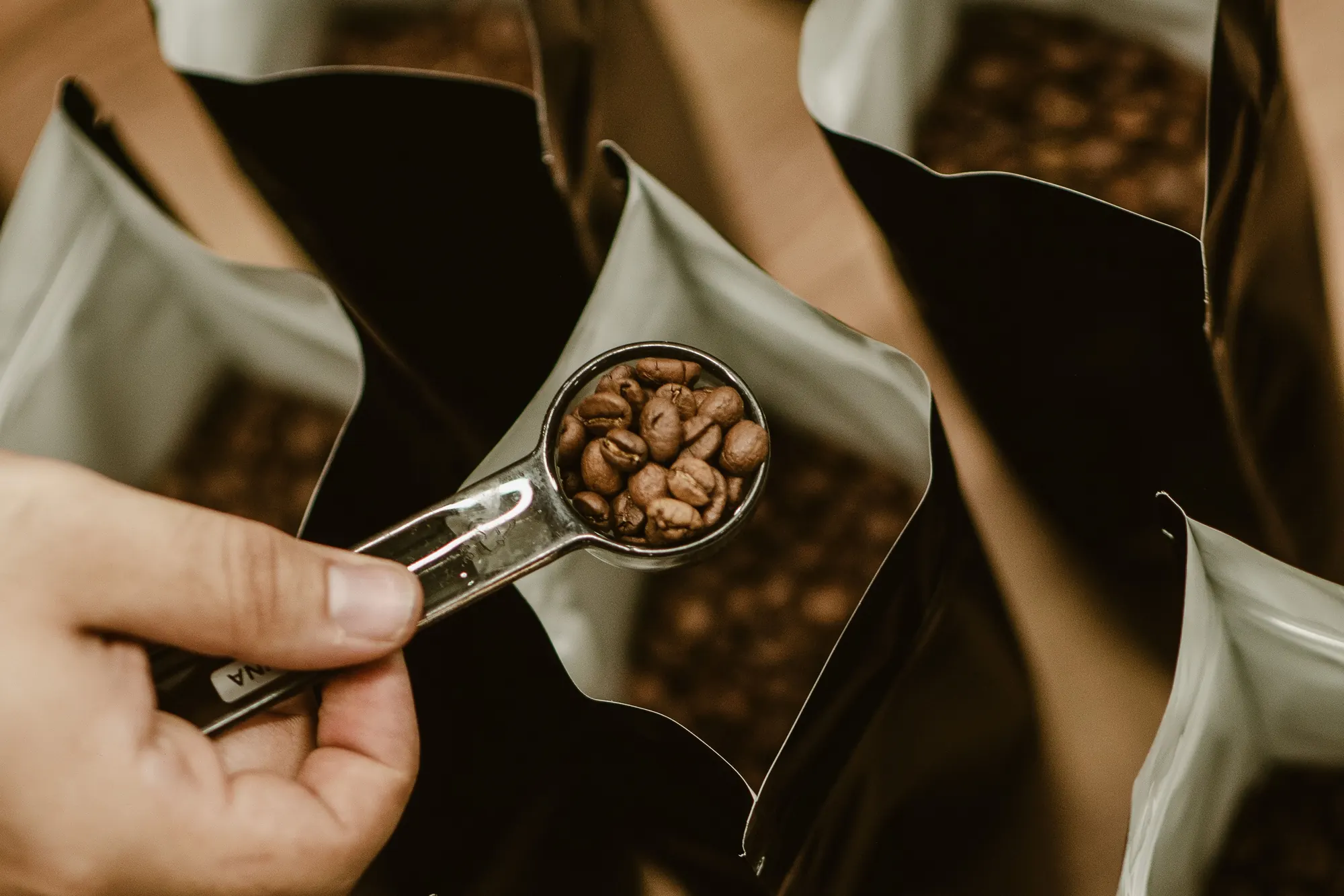 Roasted coffee beans going into bags