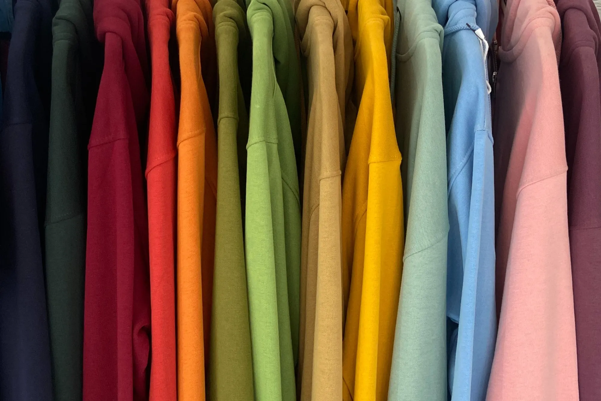A rail of hoodies in every colour